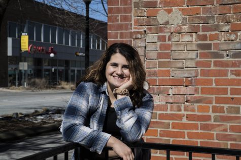 Yasmina Sahir, a journalist who writes opinion pieces at The Daily Iowan poses for a portrait on Sunday, Feb 27, 2022 in front of the Starbucks on the corner of Clinton and Burlington in Iowa City.