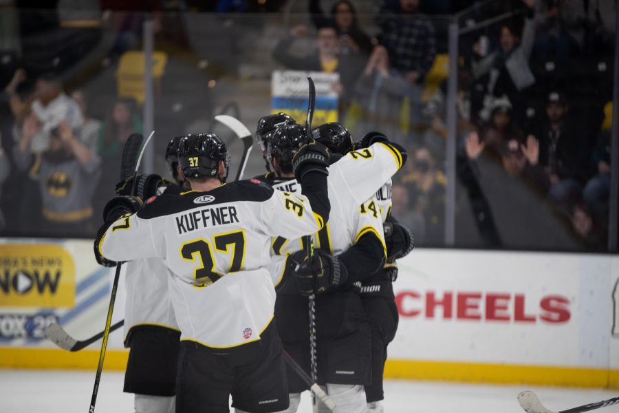 Players celebrate after a goal during a game between the Iowa Heartlanders and the Fort Wanye Komets at Xtream Arena on Feb.27 2022. The Heartlanders defeated the Comets 6-2 on Feb. 27 2022 at Xtream Arena at Iowa River Landing.