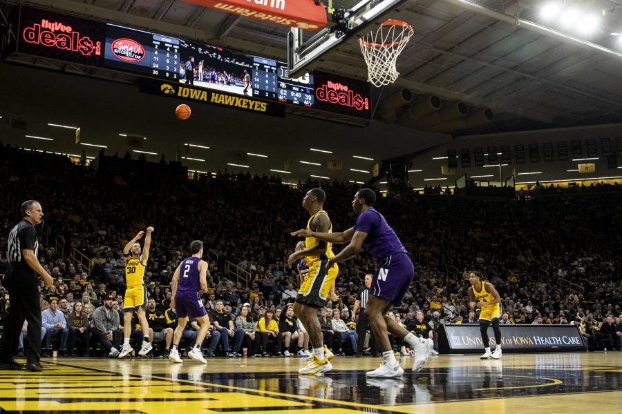 Iowa guard Connor McCaffery shoots a 3-pointer during a mens basketball game between No. 24 Iowa and Northwestern in Carver-Hawkeye Arena on Monday, Feb. 28, 2022. The Hawkeyes defeated the Wildcats, 82-61.