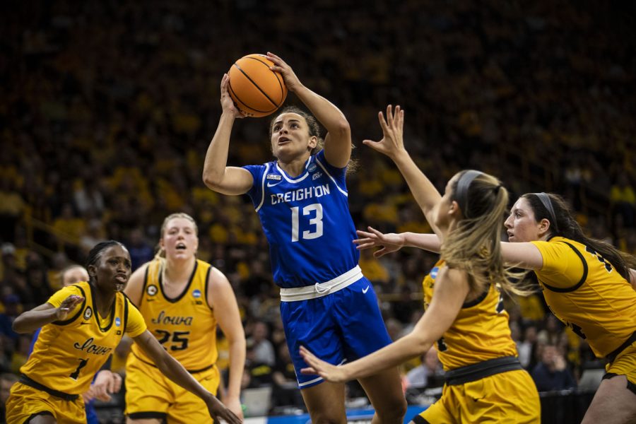 Creighton guard Rachael Saunders goes up for a shot during a 2022 NCAA Second Round women’s basketball game between No. 2 Iowa and No. 10 Creighton in sold-out Carver-Hawkeye Arena on Sunday, March 20, 2022.
