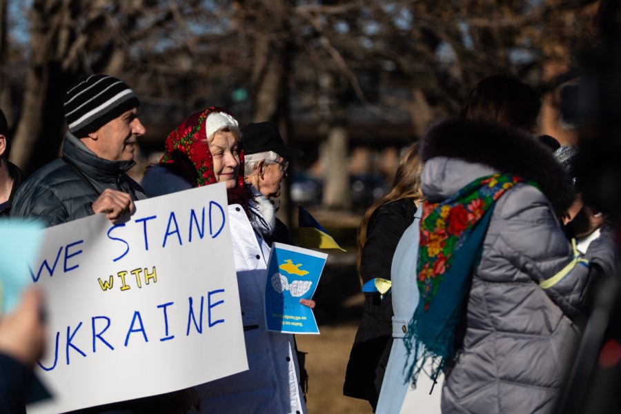 Demonstrators listen to speakers during a pro-Ukraine demonstration at the Pentacrest at the University of Iowa in Iowa City. Around 80 people attended the demonstration. 
