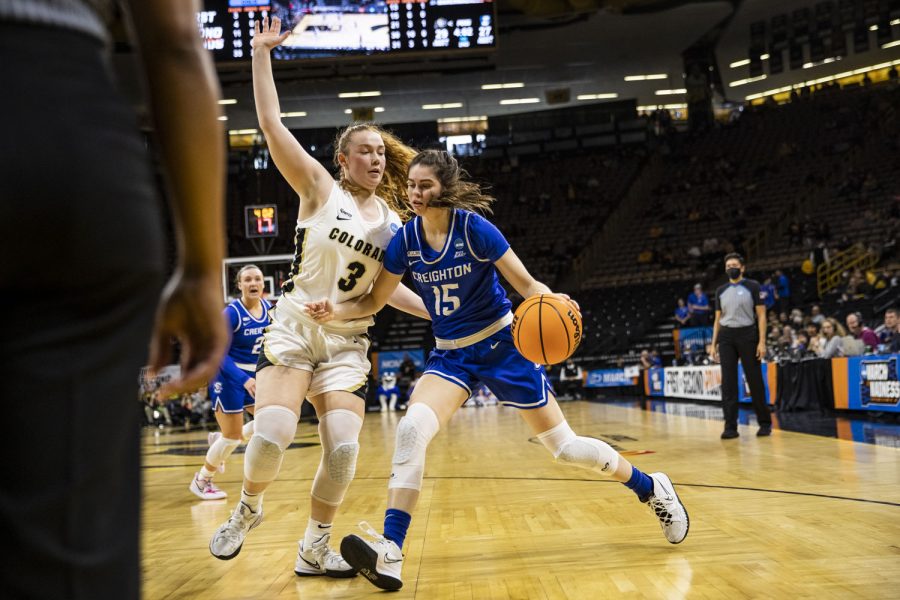 Creighton guard Lauren Jensen dribbles past Colorado guard Frida Formann during a First Round NCAA women’s basketball tournament game against No. 7 Colorado and No. 10 Creighton in Carver-Hawkeye Arena on Friday, March 18, 2022.