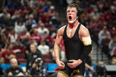 Iowa’s No. 4 Max Murin celebrates his win against Northwestern’s No. 5 Yahya Thomas during session one of the Big Ten Wrestling Championships at Pinnacle Bank Arena in Lincoln, Neb., on Saturday, March 5, 2022.  Murin defeated Thomas in the 149-pound weight class, 6-5.