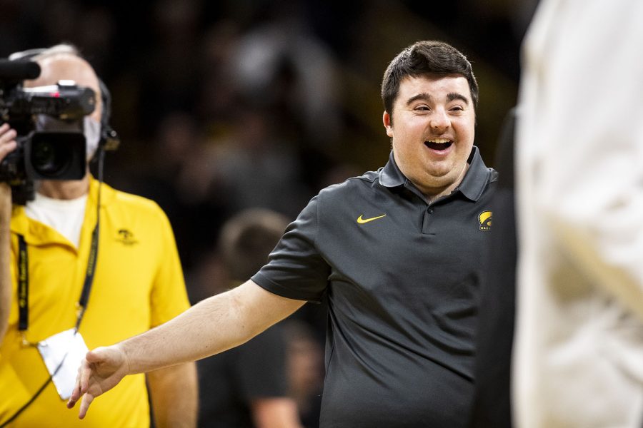Iowa’s senior student manager Jack Devlin celebrates hitting a half court shot during a timeout in a men’s basketball game between No. 24 Iowa and Northwestern in Carver-Hawkeye Arena on Monday, Feb. 28, 2022. Devlin took part in Iowa’s senior day festivities. The Hawkeyes defeated the Wildcats, 82-61.