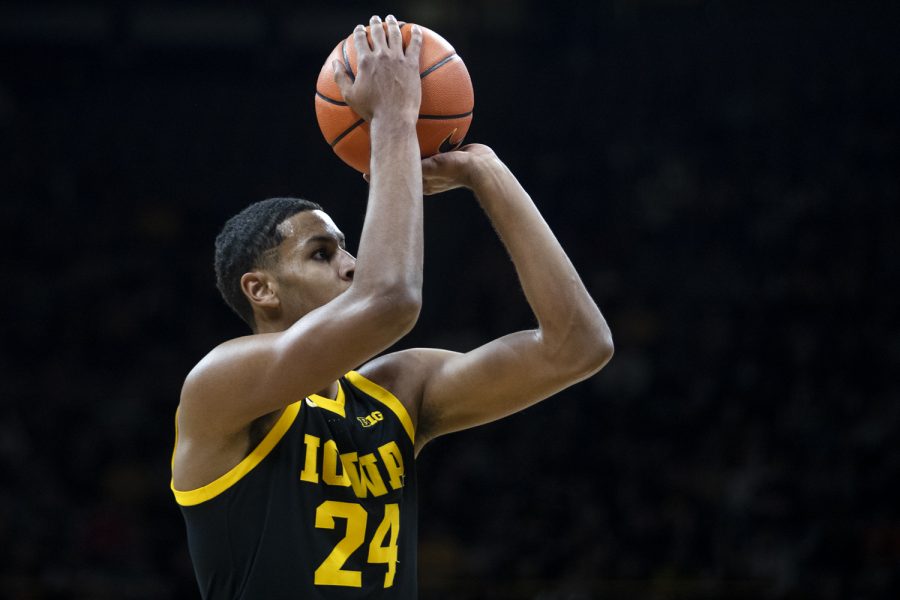 Iowa forward Kris Murray shoots a 3-pointer during a men’s basketball game between Iowa and Illinois at Carver-Hawkeye Arena in Iowa City on Monday, Dec. 6, 2021. Murray shot 3-8 on the night. The Fighting Illini defeated the Hawkeyes, 87-83.