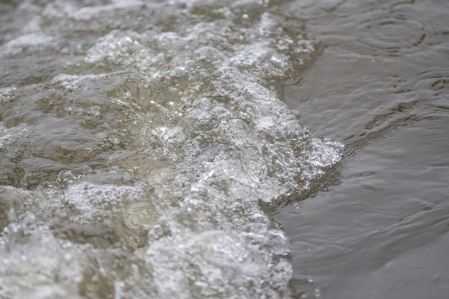 Water runs down the Iowa River in Iowa City on Wednesday, March 23, 2022. 