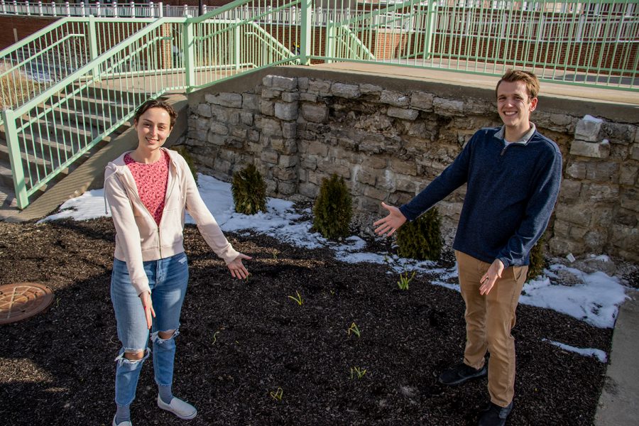 Libbie Smith, the Director of Sustainability for the University of Iowa Student Government, and Patrick Johnson, a member of the Student Government, show the new spot for a garden that will be planted on April 28, next to the foot bridge on Wednesday, March 9, 2022.
