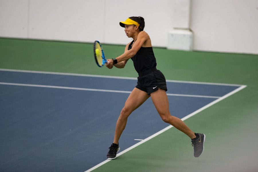 Iowa’s Michelle Bacalla defends her side of the court during a women’s tennis meet between Iowa and Illinois at the Hawkeye Tennis & Recreation Complex on Friday, April 1, 2022. Bacalla lost her match, 2-1. The Illini defeated the Hawkeyes, 4-2.