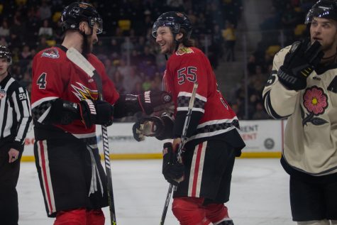Indy defensemans Kirill Chaika and Christopher Cameron celebrate after a Fuel-made goal during a hockey game between the Iowa Heartlanders and the Indy Fuel at Xtream Arena in Coralville on Saturday, April 9, 2022. The Fuel defeated the Heartlanders, 6-2.