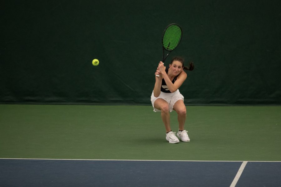 Iowa’s Marisa Schmidt hits a ball during a women’s tennis match between Iowa and No. 37 Northwestern at the Hawkeye Tennis & Recreation Complex on Sunday, April 3, 2022. Schmidt lost her singles match, 2-1. The Wildcats defeated the Hawkeyes, 6-1.