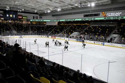 A puck drops during a hockey match between Iowa and Wheeling at Xtream Arena in Coralville on Wednesday, April 6, 2022.