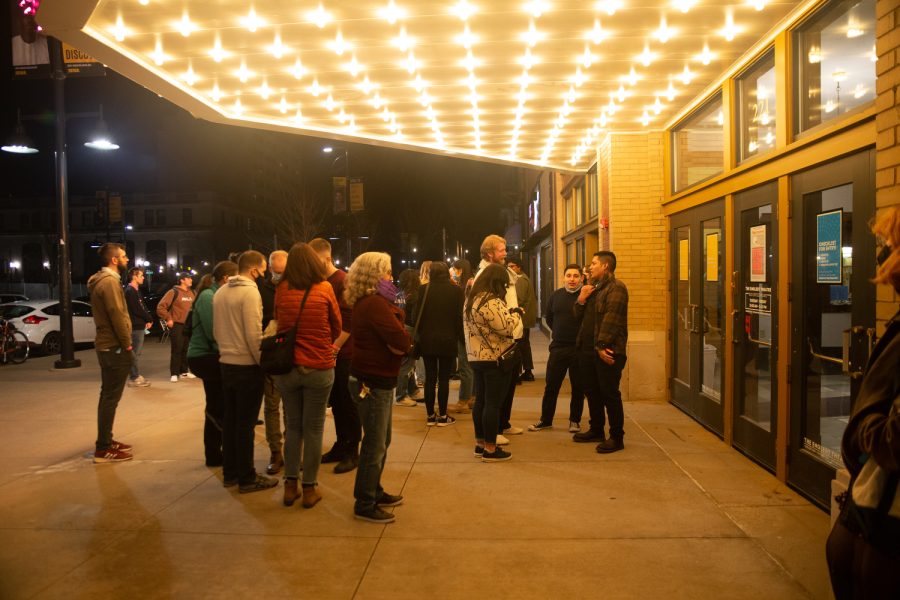 Concert goers gather outside Englert Theatre in Iowa City on Saturday, April 9, 2022.
