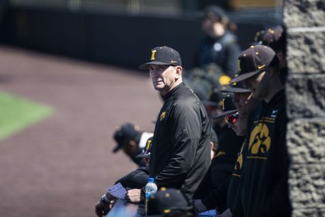 Iowa head coach Rick Heller smiles during the first baseball game of a doubleheader between Iowa and Illinois at Duane Banks Field in Iowa City on Saturday, April 9, 2022. The Hawkeyes defeated the Fighting Illini, 4-2.