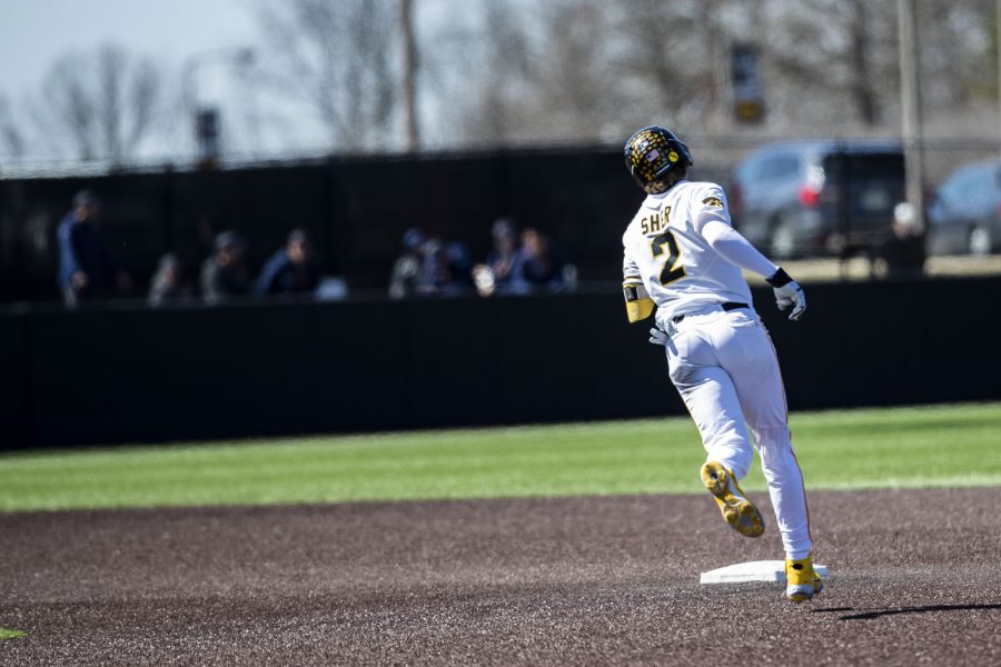 Iowa second baseman Brendan Sher runs the bases after scoring a home run during the first baseball game of a doubleheader between Iowa and Illinois at Duane Banks Field in Iowa City on Saturday, April 9, 2022. The Hawkeyes defeated the Fighting Illini, 4-2.