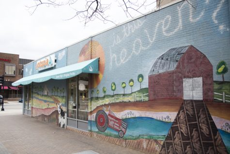 The “Is This Heaven? No, It’s the Ped Mall” mural is seen in the Pedestrian Mall in Iowa City on Friday, April 8, 2022. 