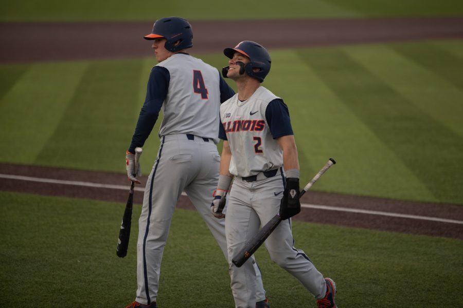 Illinois secondbaseman Brody Harding shines a smile to his teammates after scoring a run during a baseball game between Iowa and Illinois at Duane Banks Field on Sunday, April 10, 2022.  Harding scored two runs and drove in a run during the game. The Fighting Illini defeated the Hawkeyes, 9-5.