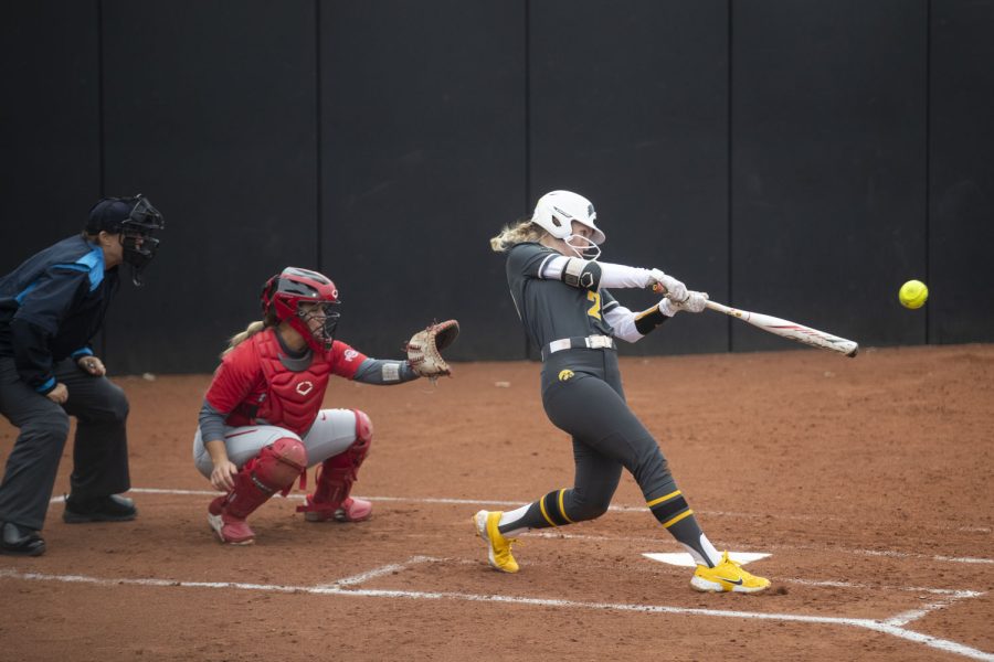 Iowa batter Sophie Maras hits a ball during a softball game between Iowa and Ohio State at Bob Pearl Softball Field in Iowa City on Friday, April 15, 2022. The Buckeyes defeated the Hawkeyes, 7-3.