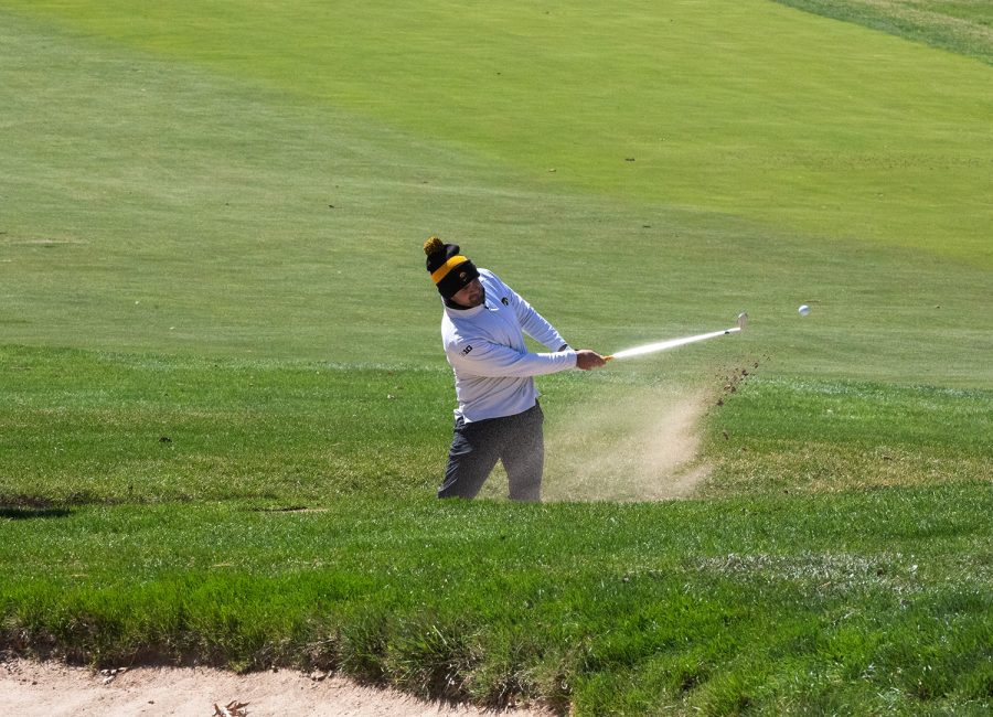 Iowa’s Mac McClear hits a golf ball out of the rough during the 2022 men’s golf Hawkeye Invitational at Finkbine Golf Course on April 16, 2022.