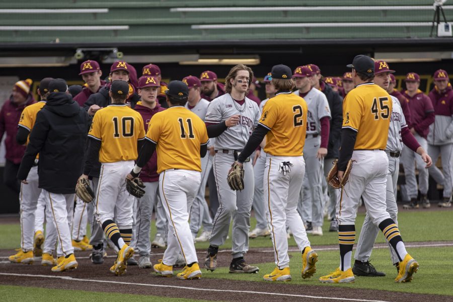 Iowa and Minnesota shake hands after a baseball game between Iowa and Minnesota at Duane Banks Field in Iowa City on Sunday, Apr. 17, 2022. The Hawkeyes defeated the Golden Gophers, 9-3.
