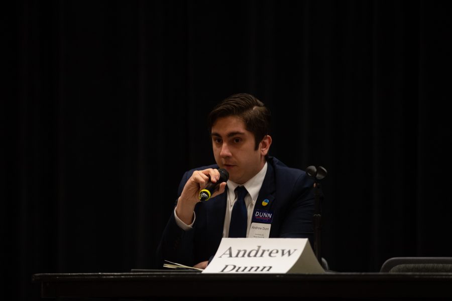 Andrew Dunn, democratic candidate running for Iowa House District 90, holds the microphone while passionately speaking about bipartisanship during the University of Iowa Faculty Staff Legislative Forum at the Iowa Memorial Union on Monday, April 18, 2022. 