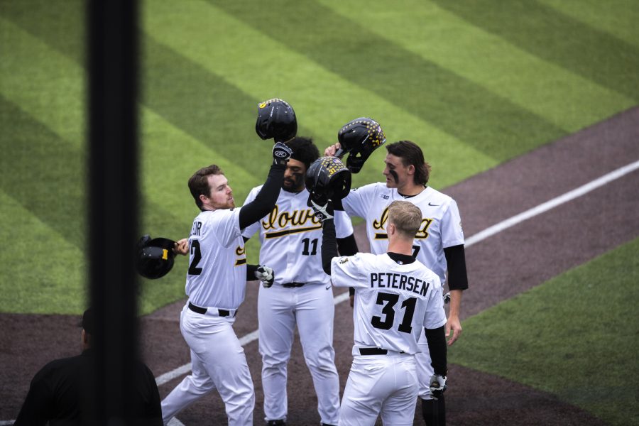 Iowa designated hitter Will Mulfer celebrates with his teammates after a home run during a baseball game between Iowa and Bradley at Duane Banks Field in Iowa City on Tuesday, April 19, 2022. Mulfer hit one home run. The Hawkeyes defeated the Braves, 15-8.