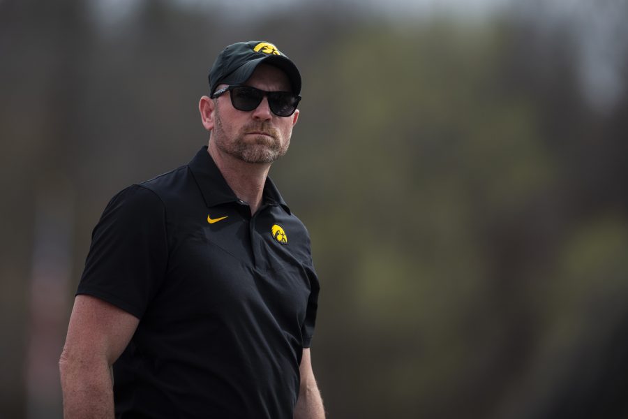 Iowa head coach Joey Woody watches action during the Musco Twilight at Francis X. Cretzmeyer Track in Iowa City on Saturday, April 23, 2022. Iowa hosted its only outdoor meet this season.