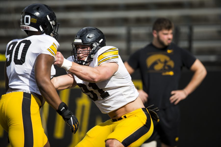 Iowa defensive lineman Lukas Van Ness competes in a drill with defensive end Brian Allen during a spring practice at Kinnick Stadium on Saturday, April 23, 2022.