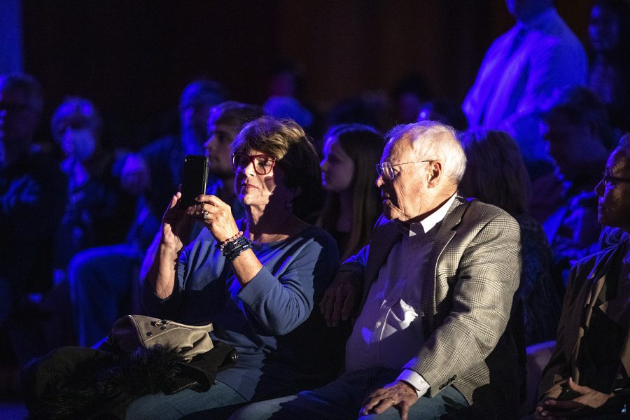 An attendee takes a photos of former Trump Advisor Kellyanne Conway, during her visit to the University of Iowa at the Iowa Memorial Union on Thursday, April 28, 2022. Iowa Young America’s Foundation organized the event. 