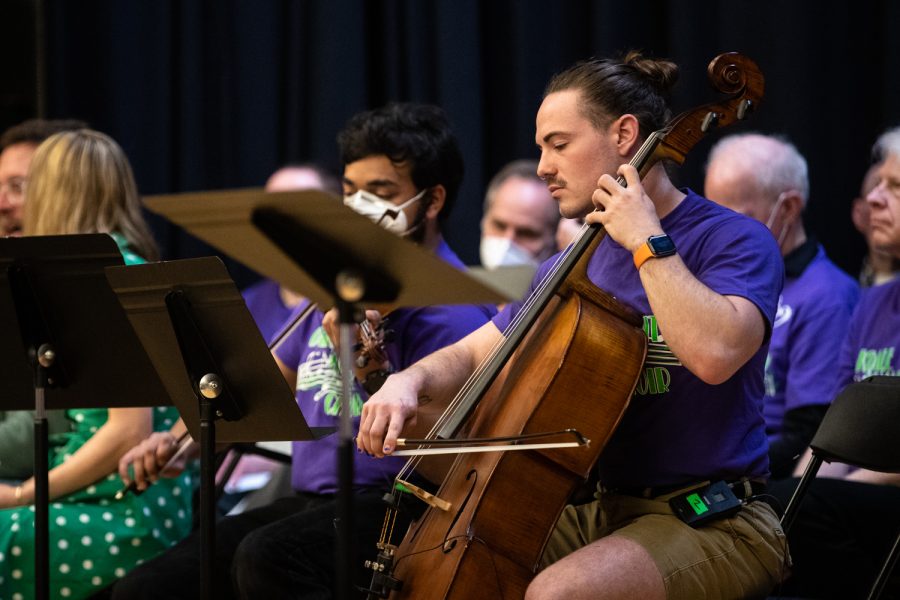 A band member plays music at a planting ceremony for an Anne Frank sapling at MacBride Hall at the University of Iowa on Friday, April 29, 2022. The sapling was propagated from the chestnut tree behind the annex where Anne and family hid.