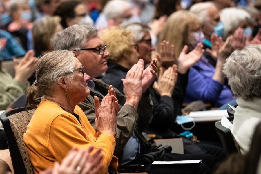 Attendees clap at a planting ceremony for an Anne Frank sapling at MacBride Hall at the University of Iowa on Friday, April 29, 2022. The sapling was propagated from the chestnut tree behind the annex where Anne and family hid.