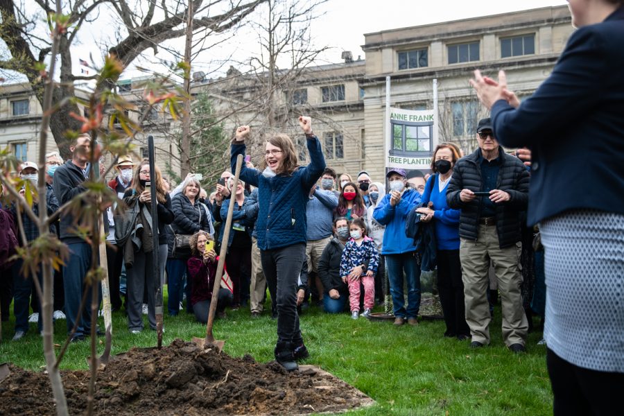A community member celebrates a planting ceremony for an Anne Frank Sapling at the Pentacrest at the University of Iowa on Friday, April 29, 2022. The sapling was propagated from the chestnut tree behind the annex where Anne and family hid.