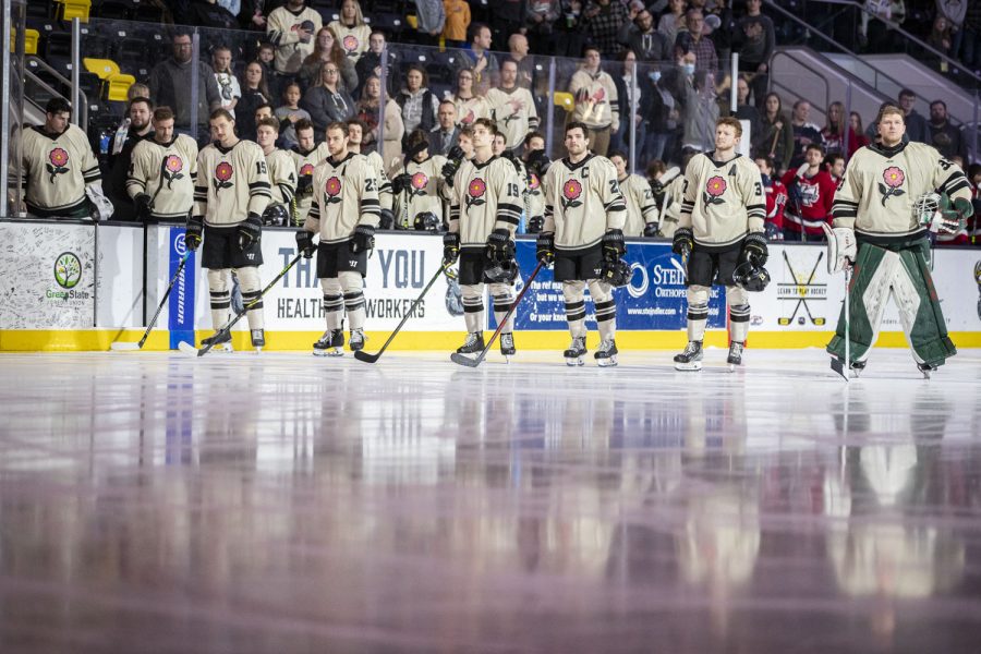The Iowa Heartlanders stand for the national anthem before a hockey game between Iowa and Kalamazoo at Xtream Arena in Coralville on Friday, April 8, 2022. The Heartlanders defeated the Wings, 4-2. 