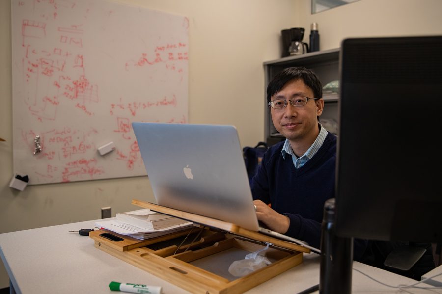 University+of+Iowa+researcher+Tianbao+Yang+seats+at+his+desk+where+he+works+on+AI+research+on+Friday%2C+Aril+8%2C+2022.