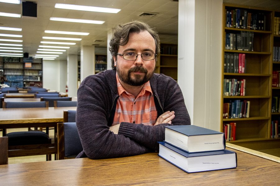 Mike Meginnis, an academic coach at the University who wrote his first novel, poses for a portrait in the Main Library on Saturday April 2, 2022.
