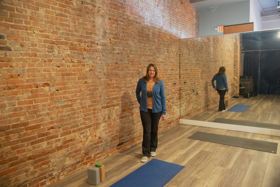 Benders Studio Owner Cara Flynn poses for a portrait in a yoga studio on April 21, 2022. 