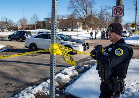 Police investigate a shooting shooting outside of East High School in in Des Moines, IA, on Monday, March 7, 2022. (Zach Boyden-Holmes-USA TODAY NETWORK)