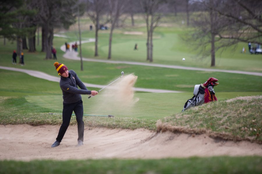Minnesota’s Antoine Sale wedges a ball out of a bunker during day two of the Hawkeye Invitational at Finkbine Golf Course in Iowa City on April 17, 2022. Sale finished with a score of 218.