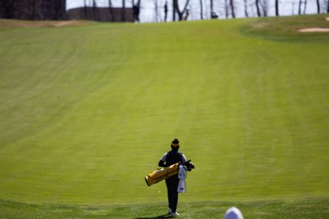 Iowa’s Garrett Tighe walks down the course during day two of the Hawkeye Invitational at Finkbine Golf Course in Iowa City on April 17, 2022. Tight finished in 2nd place with a score of 209.