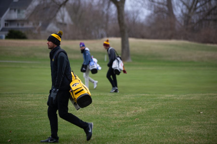 Iowa’s Garrett Tighe walks separately from his opponents during day two of the Hawkeye Invitational at Finkbine Golf Course in Iowa City on April 17, 2022. Tighe finished in 2nd place with a score of 209.