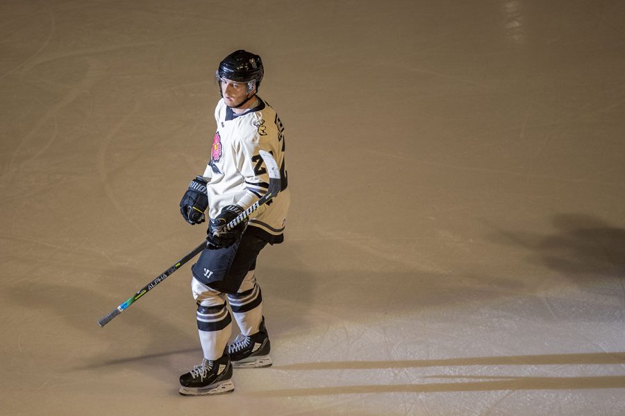 Iowa forward Josh Koepplinger stands in the spotlight after the Heartlanders scored a goal during a hockey game between Iowa and Kalamazoo at Xtream Arena in Coralville, IA on Friday, April 8, 2022. The Heartlanders defeated the Wings 4-2. (Ayrton Breckenridge/The Daily Iowan)