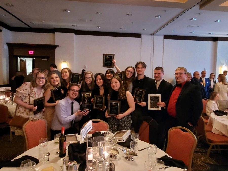 Daily Iowan staff members hold first-place awards at the Iowa Newspaper Associations Better Newspaper Contest on Thursday, April 28, 2022. (contributed)