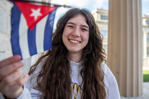 University of Iowa first-year multiracial student Kate Perez poses for a portrait on the Pentacrest on Monday, April 18, 2022. 