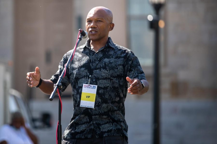 Iowa Democratic Party Chair Ross Wilburn leads a speech during a rally for voting rights at the Pentacrest on Saturday, Aug. 28, 2021. 