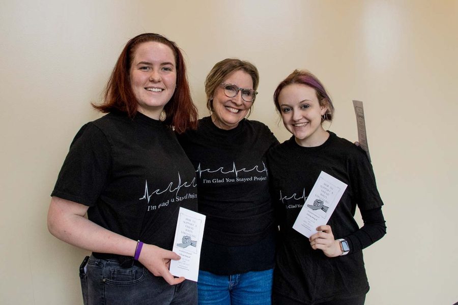 Nikki Pinter, Dottie Schley, and Abbey Schley, pose for a portrait at the Iowa Memorial Union in Iowa City on Wednesday, April 19, 2022. Abbey Schley started an organization known as the I’m Glad You Stayed project, which raises awareness for teen suicide. The project was created in loving memory of Dylan Salge.