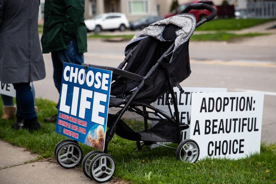 A baby stroller with anti-abortion signs rests outside the Emma Goldman Clinic on Thursday, May 5, 2022. Around 15 people attended the demonstration. 