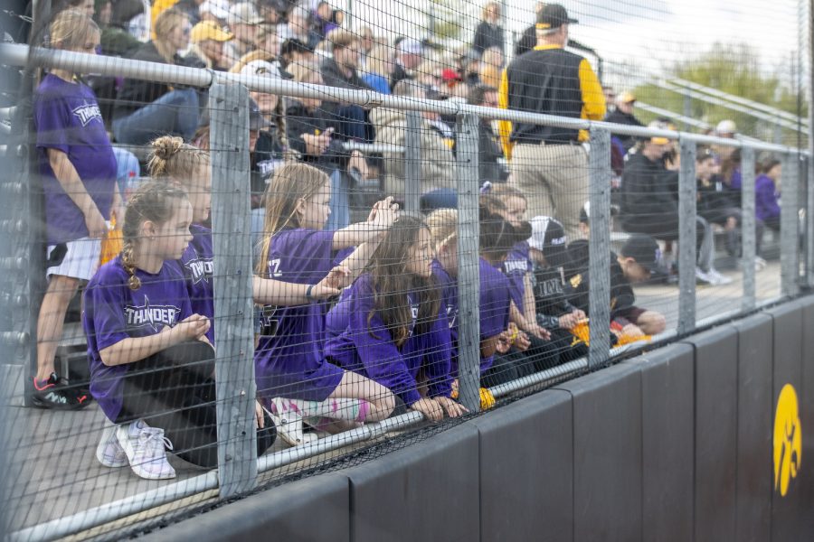 Youth softball fans watch the play during a softball game between Iowa and Purdue at Pearl Field in Iowa City on Friday, May 6, 2022. The Boilermakers defeated the Hawkeyes, 5-1.