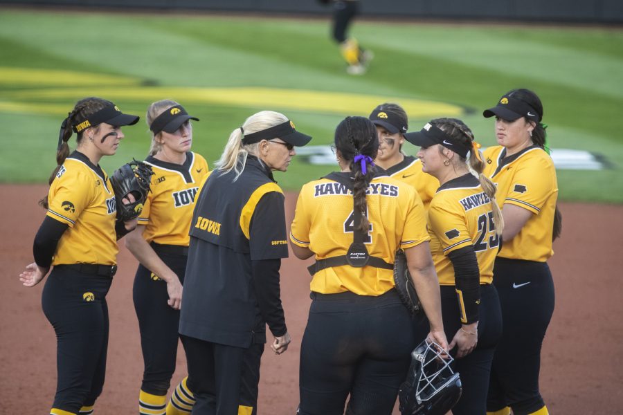 Iowa discusses during a mound visit in a softball game between Iowa and Purdue at Pearl Field in Iowa City on Friday, May 6, 2022. The Boilermakers defeated the Hawkeyes, 5-1.
