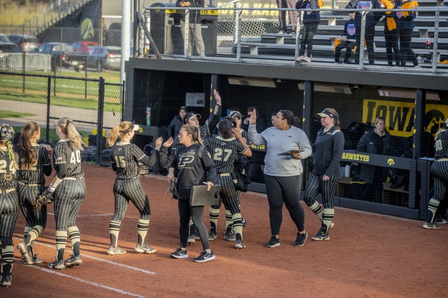 Purdue celebrates after an inning during a softball game between Iowa and Purdue at Pearl Field in Iowa City on Friday, May 6, 2022. The Boilermakers defeated the Hawkeyes, 5-1.