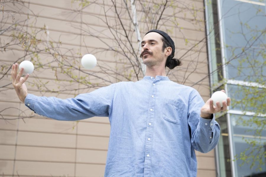 Luther Bangert juggles at Chauncey Swan Park in Iowa City on Friday, May 6, 2022.