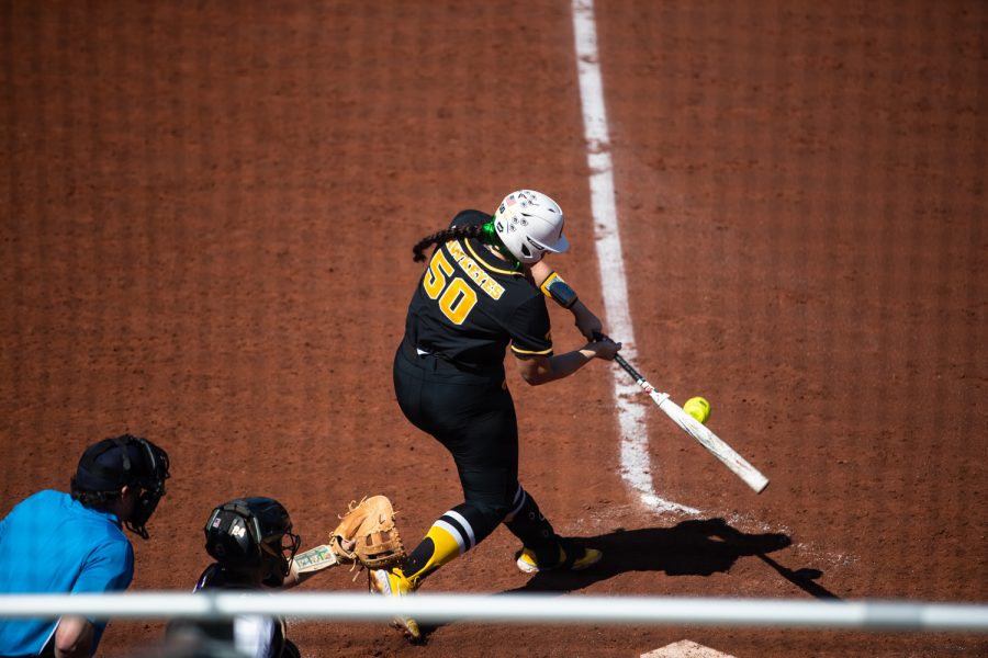 Iowa first baseman Kalena Burns hits the ball during a softball game between Iowa and Purdue at Bob Pearl Field in Iowa City on Saturday, May 7, 2022. Burns earned one run. The Hawkeyes beat the Boilermakers, 9-3.
